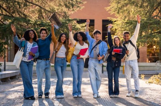 Group,Of,Young,,Happy,,Diverse,University,Students,Standing,Together,,Raising